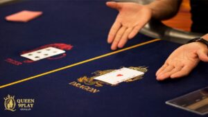 a hands showing an ace of hearts on dragon side in a dragon tiger table