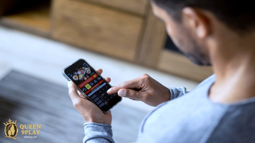 a man betting on sports on an online gambling site using his phone.